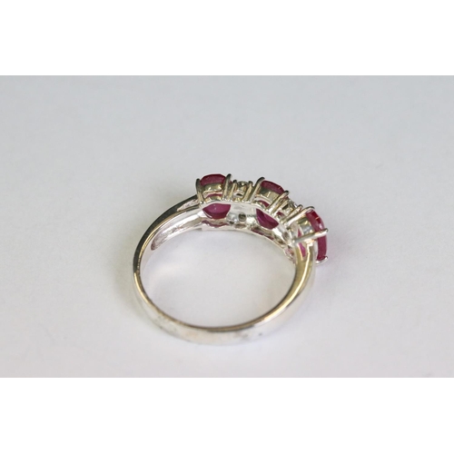 255 - Silver and CZ rubellite five stone ring