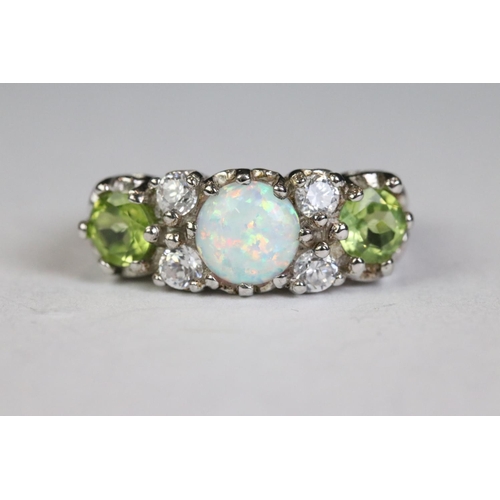 259 - Silver five stone ring set with peridot, CZ & opal