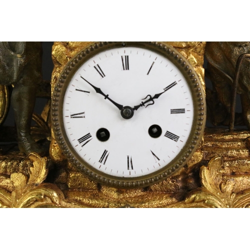 183 - An antique French gilt mantle clock with decorative ironmonger figures.