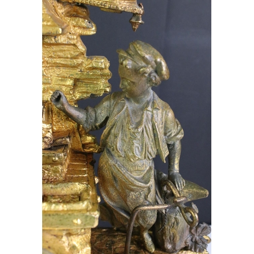 183 - An antique French gilt mantle clock with decorative ironmonger figures.