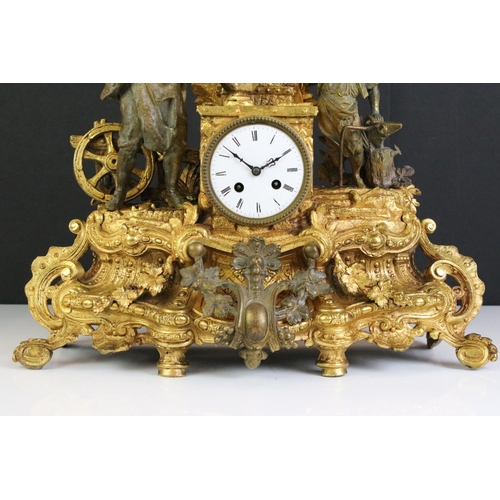 183 - An antique French gilt mantle clock with decorative ironmonger figures.