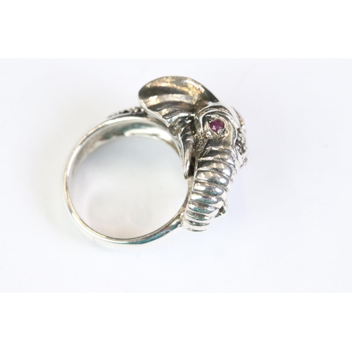 267 - Silver elephant style ring set with ruby eyes