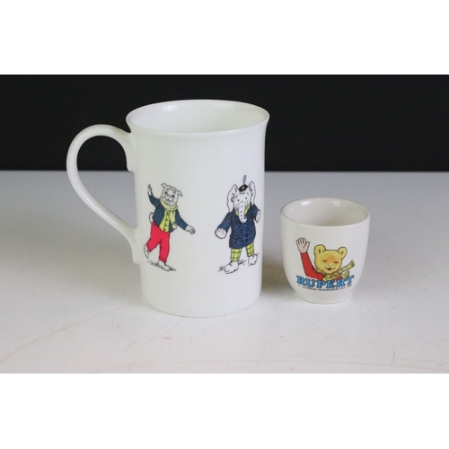 380 - Group of Rupert The Bear related collectables, to include books, mug, poster, Christmas Tree ornamen... 