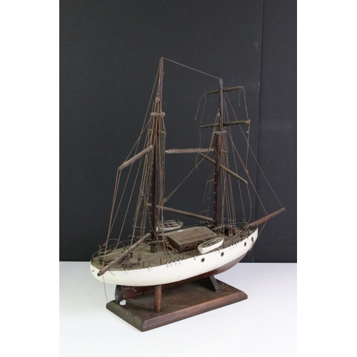 383 - A vintage kit built twin mast wooden ship on stand.