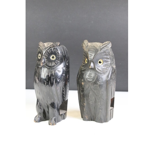 396 - A group of five carved wooden animals to include a Black Forest style bear, two owls and two ducks.