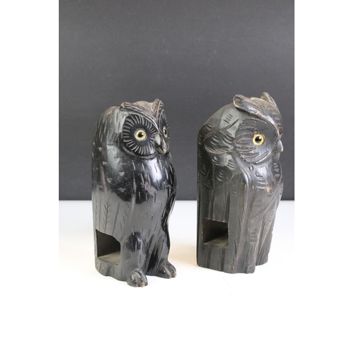 396 - A group of five carved wooden animals to include a Black Forest style bear, two owls and two ducks.