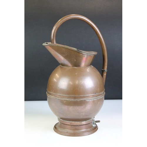 397 - A collection of mixed brass and copper ware to include Jugs, Vases, preserve pan and a fire guard.