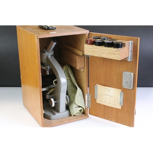 398 - Two vintage microscopes to include a Prior London and a cased Senior example.