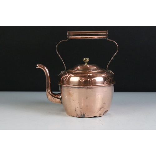 410 - A collection of mixed metalware to include a copper kettle, two brass mortars, pewter bowl and a qua... 