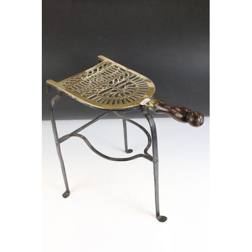 412 - A small group of brass trivets and fire side tools including a 17th century downhearth toasting fork... 