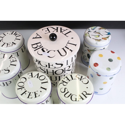 414 - A collection of six Emma Bridgewater tin storage jars together with a biscuit barrel.