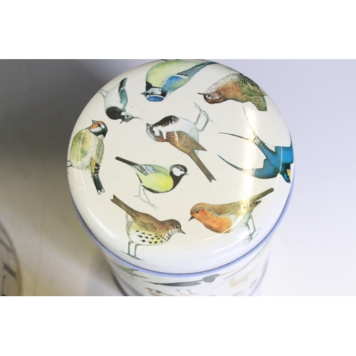 414 - A collection of six Emma Bridgewater tin storage jars together with a biscuit barrel.