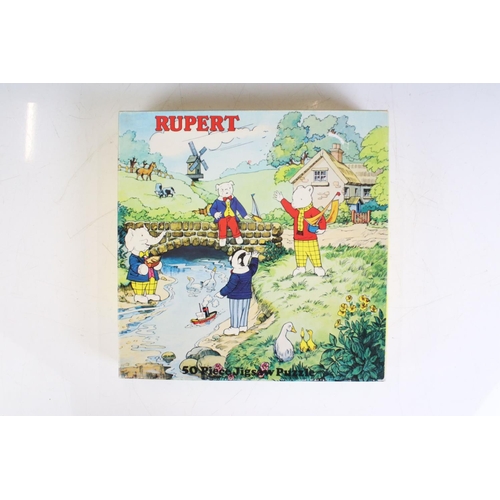 415 - Eight Rupert The Bear related jigsaw puzzles, unchecked for completeness