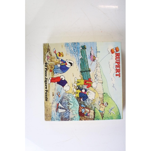 415 - Eight Rupert The Bear related jigsaw puzzles, unchecked for completeness