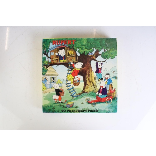 415 - Eight Rupert The Bear related jigsaw puzzles, unchecked for completeness