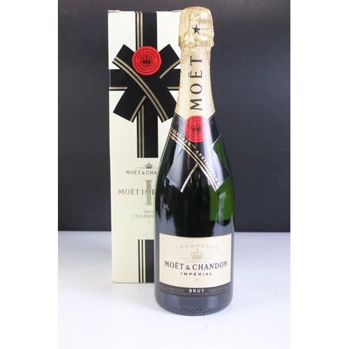 422 - A boxed bottle of Moet & Chandon Moet Imperial 150th anniversary together with a miniature bottle of... 