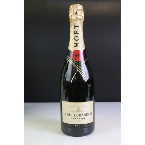 422 - A boxed bottle of Moet & Chandon Moet Imperial 150th anniversary together with a miniature bottle of... 