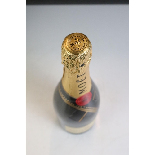 422 - A boxed bottle of Moet & Chandon Moet Imperial 150th anniversary together with a miniature bottle of... 