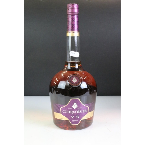 423 - A bottle of Courvoisier V.S. Cognac together with a bottle of Remy Martin V.S.O.P. and a bottle of 1... 