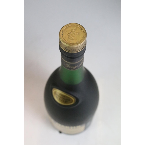 423 - A bottle of Courvoisier V.S. Cognac together with a bottle of Remy Martin V.S.O.P. and a bottle of 1... 