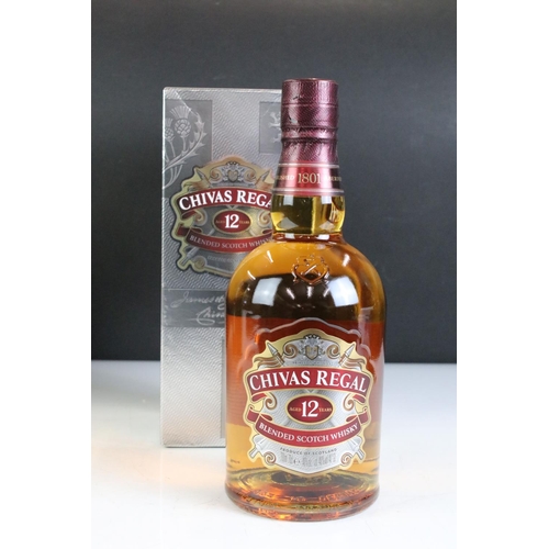 423 - A bottle of Courvoisier V.S. Cognac together with a bottle of Remy Martin V.S.O.P. and a bottle of 1... 