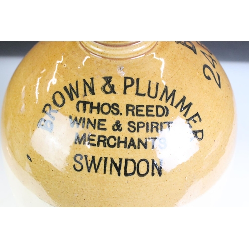 430 - A pair of vintage stoneware bottles to include a Swindon advertising example.