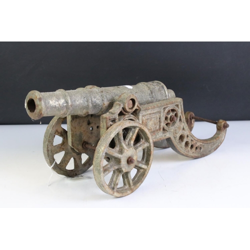 431 - Cast Metal Model of an Artillery Canon, 45cm long together with an Oak Stand carved with the initial... 