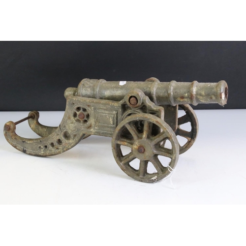 431 - Cast Metal Model of an Artillery Canon, 45cm long together with an Oak Stand carved with the initial... 