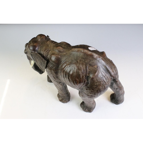 460 - Small Brown Leather Liberty style Rhino together with Four other Leather covered Animals including K... 