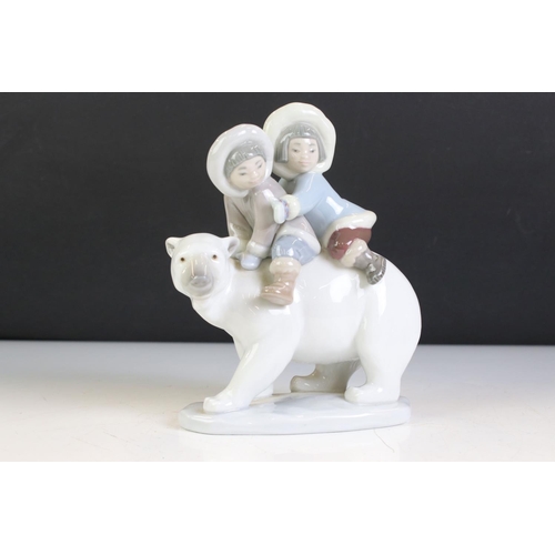 77 - Lladro Porcelain Eskimo Riders, model no. 5353, 18cm high