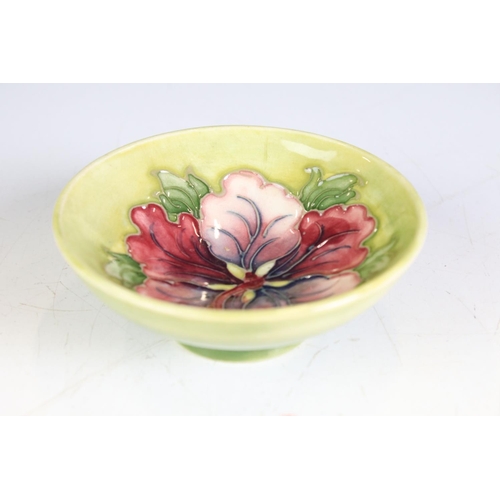 80 - Moorcroft Pottery Bowl decorated in the Hibiscus pattern on a pale green ground, Walter Moorcroft pa... 