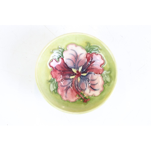 80 - Moorcroft Pottery Bowl decorated in the Hibiscus pattern on a pale green ground, Walter Moorcroft pa... 