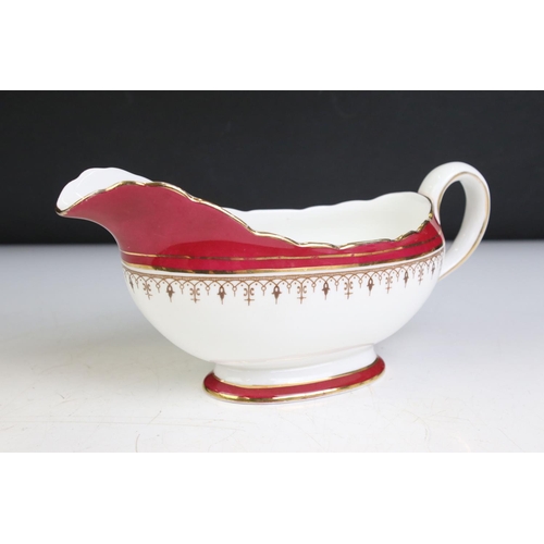 95 - Aynsley Bone China Dinner and Tea ware decorated with red deep borders and gilt highlights including... 