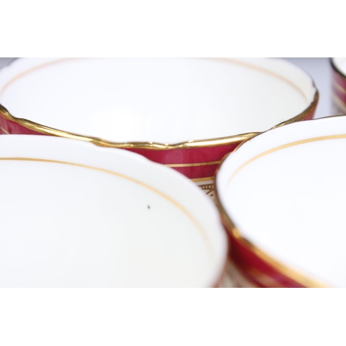 95 - Aynsley Bone China Dinner and Tea ware decorated with red deep borders and gilt highlights including... 