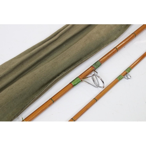 391 - Two vintage split cane fishing rods in original rod bags to include a Hardy example