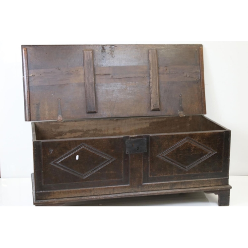 604 - 18th century Oak Coffer decorated with applied panels (possibly later), raised on bracket feet, 128c... 