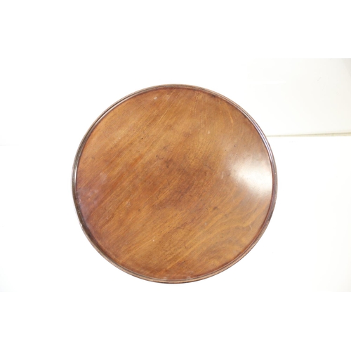 600 - George III mahogany tripod table, one pad foot chewed, approx. 56cm diameter