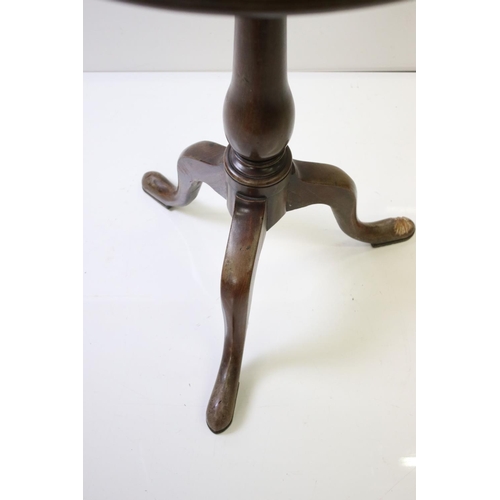 600 - George III mahogany tripod table, one pad foot chewed, approx. 56cm diameter