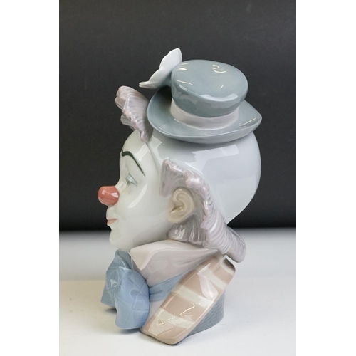 13 - Lladro ' Star Struck ' porcelain clown bust figure, model no. 5610, 22cm high, raised on a wooden ba... 