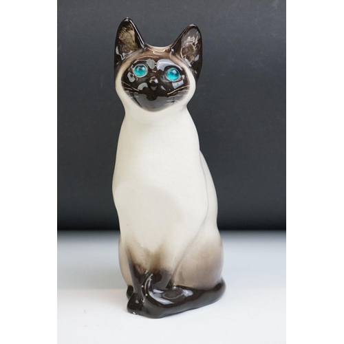 15 - Winstanley pottery figure of a seated Siamese cat, with blue glass eyes, numbered 34, signed ' Kensi... 