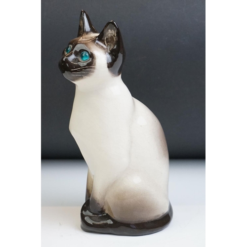 15 - Winstanley pottery figure of a seated Siamese cat, with blue glass eyes, numbered 34, signed ' Kensi... 