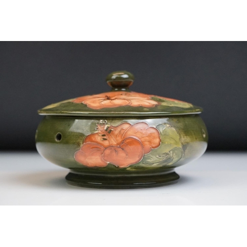 16 - Moorcroft Pottery ' Coral Hibiscus ' green ground pierced powder bowl & cover, paper label to lid, 1... 