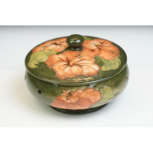 16 - Moorcroft Pottery ' Coral Hibiscus ' green ground pierced powder bowl & cover, paper label to lid, 1... 