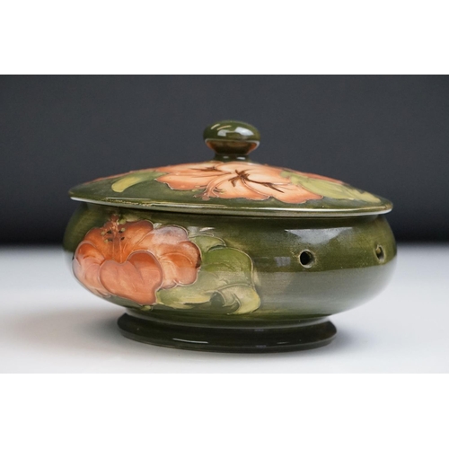 16 - Moorcroft Pottery ' Coral Hibiscus ' green ground pierced powder bowl & cover, paper label to lid, 1... 