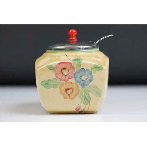 18 - Clarice Cliff for Newport Pottery - Preserve jar with floral and green banding decoration, on a must... 