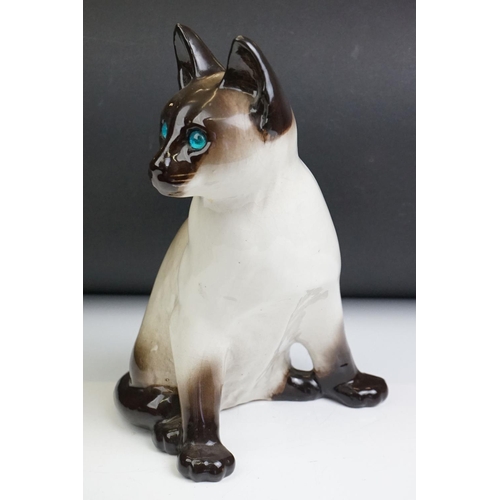 22 - Winstanley pottery model of a Seated Siamese Cat, with blue glass eyes, marked ' Kensington 32 Winst... 