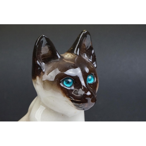 22 - Winstanley pottery model of a Seated Siamese Cat, with blue glass eyes, marked ' Kensington 32 Winst... 