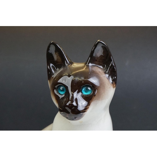 22 - Winstanley pottery model of a Seated Siamese Cat, with blue glass eyes, marked ' Kensington 32 Winst... 