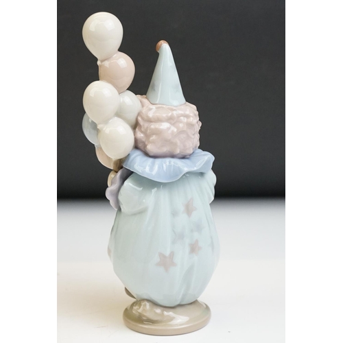 23 - Three Lladro porcelain clown figures to include 5813 ' Having A Ball ', 5279 ' Pierrot With Concerti... 