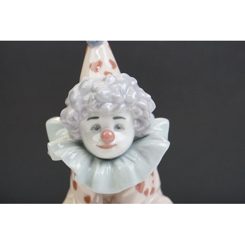 23 - Three Lladro porcelain clown figures to include 5813 ' Having A Ball ', 5279 ' Pierrot With Concerti... 